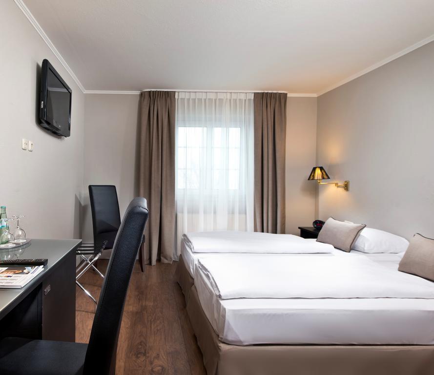 Hotel Munich North Neufahrn bei Freising Pokoj fotografie